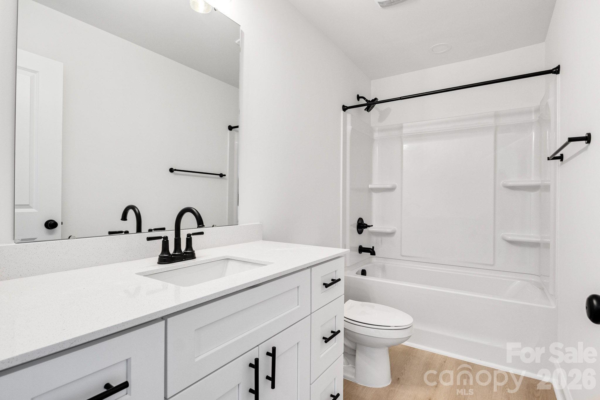 1335 Winged Way, Unit 4 Kannapolis, NC 28083 - Photo 21 of 29 a bathroom with a sink a toilet and a bathtub
