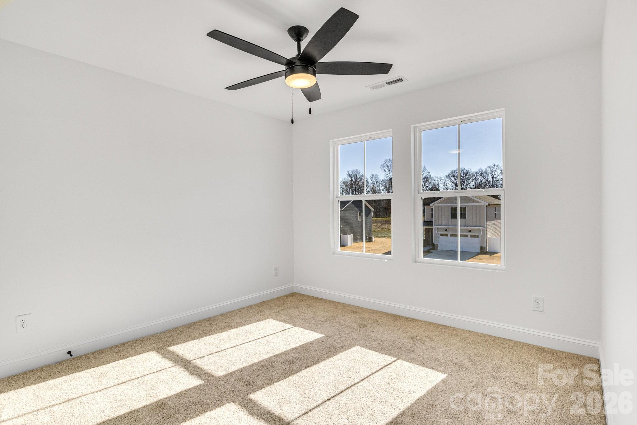 1335 Winged Way, Unit 4 Kannapolis, NC 28083 - Photo 22 of 29 a view of a big room with wooden floor and windows in a room