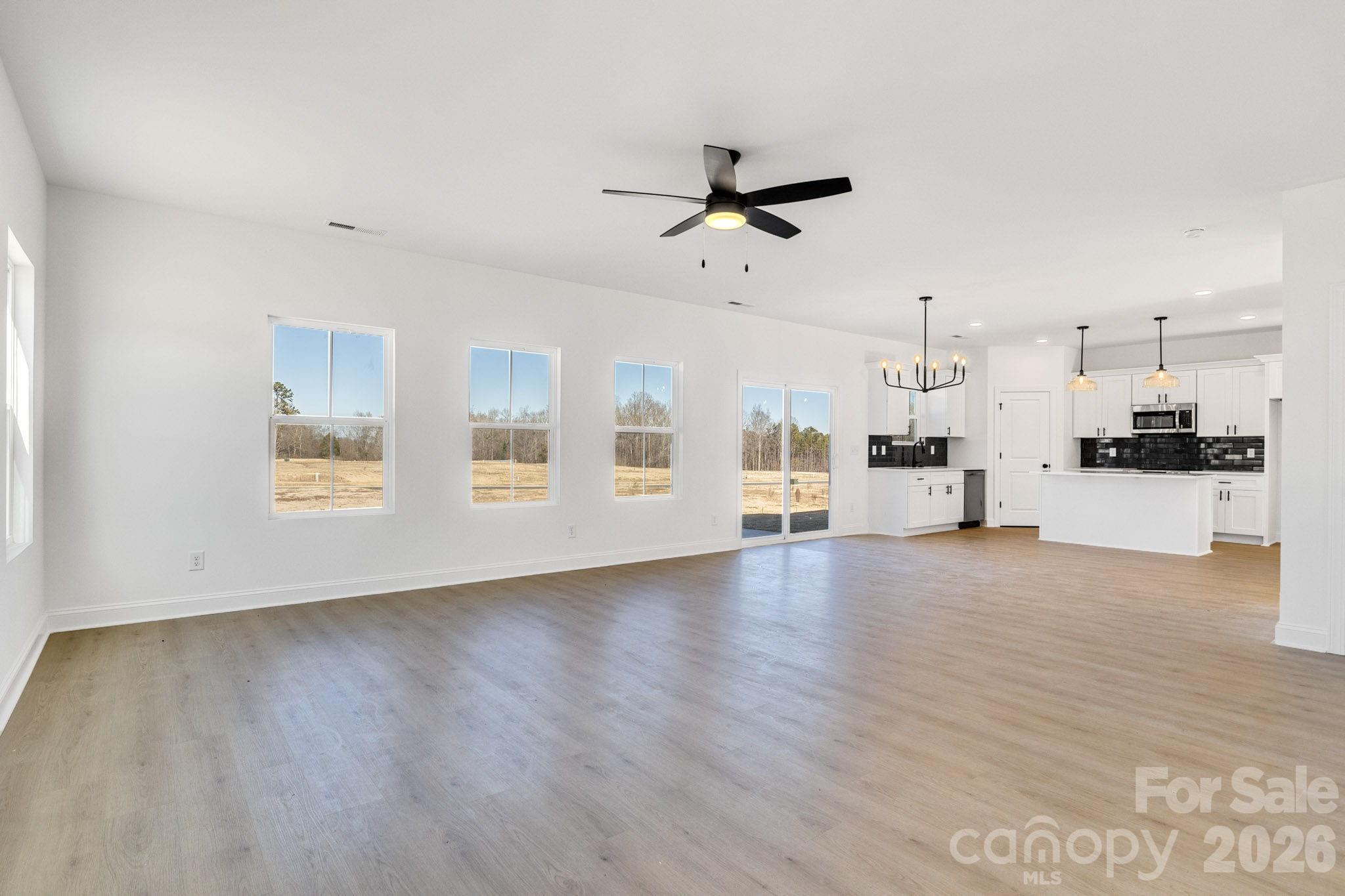 1335 Winged Way, Unit 4 Kannapolis, NC 28083 - Photo 8 of 29 a view of a kitchen with furniture and wooden floor