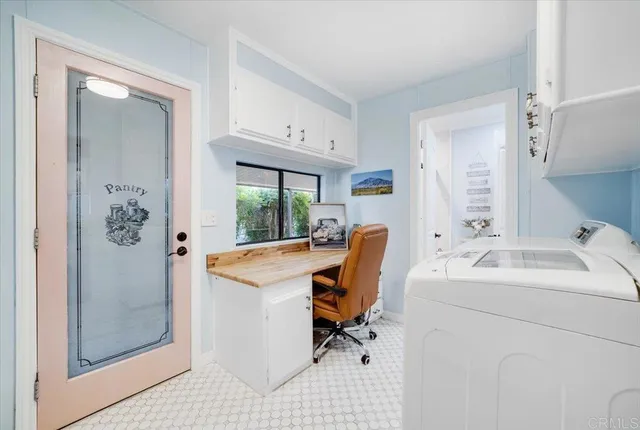 a view of a sink and cabinets