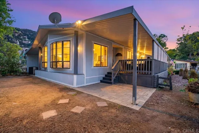 a view of a bench in the backyard