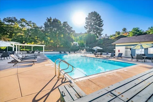 a view of a swimming pool with a patio