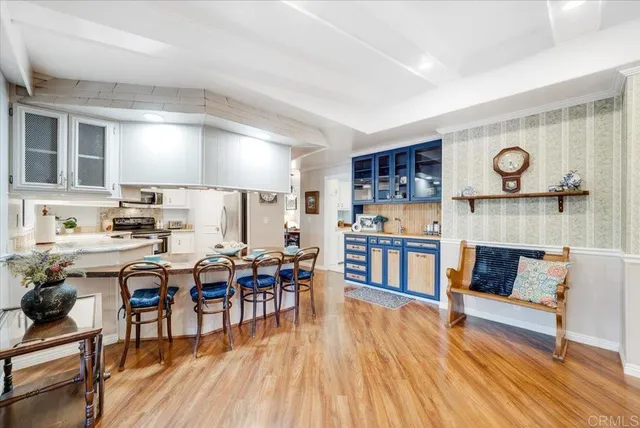 a view of a dining room with furniture and wooden floor