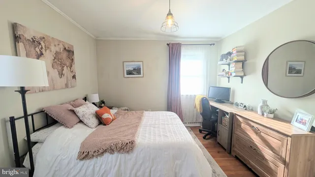 a bedroom with a large bed and a mirror