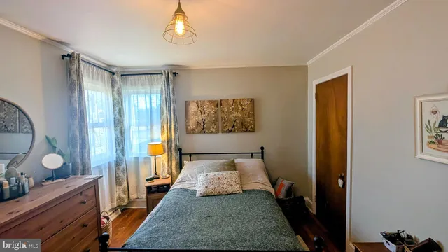 a bed room with a bed and a window