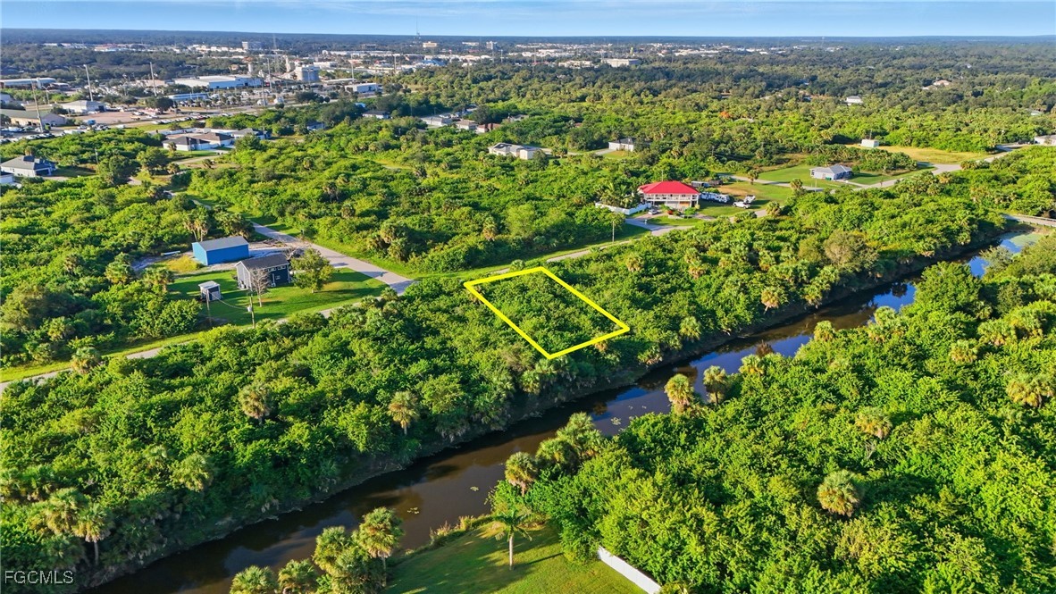 346 Rutland Circle Port Charlotte, FL 33954 - Photo 11 of 22 a view of a city with lush green forest