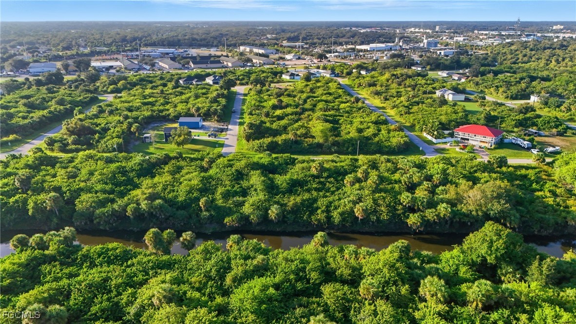 346 Rutland Circle Port Charlotte, FL 33954 - Photo 14 of 22 an aerial view of residential houses with outdoor space and trees