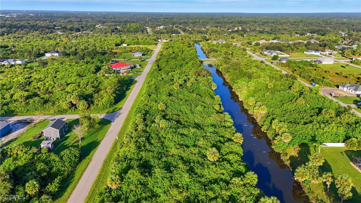 346 Rutland Circle Port Charlotte, FL 33954 - Photo 2 of 22 a view of city with lush green forest