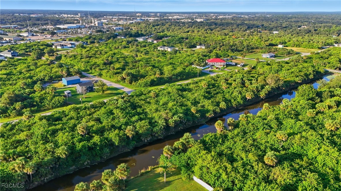 346 Rutland Circle Port Charlotte, FL 33954 - Photo 10 of 22 a view of a city with lush green forest