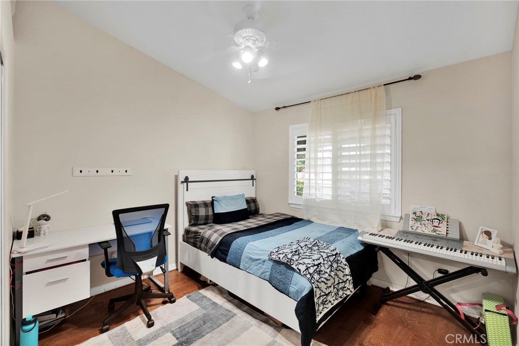 17777 Brazier Drive Riverside, CA 92508 - Photo 24 of 55 a bedroom with a bed and a chandelier