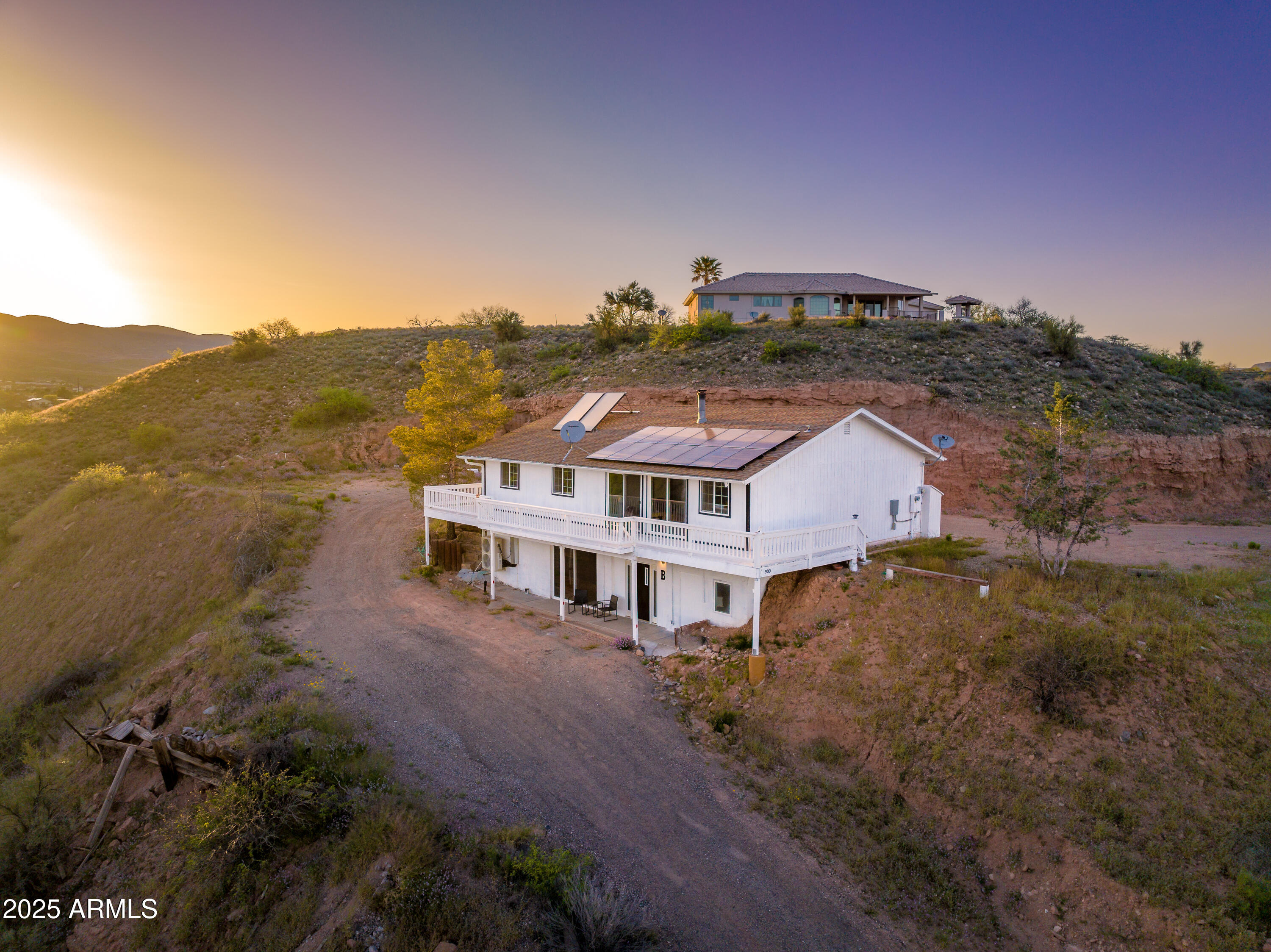 a view of a house with a mountain in the background