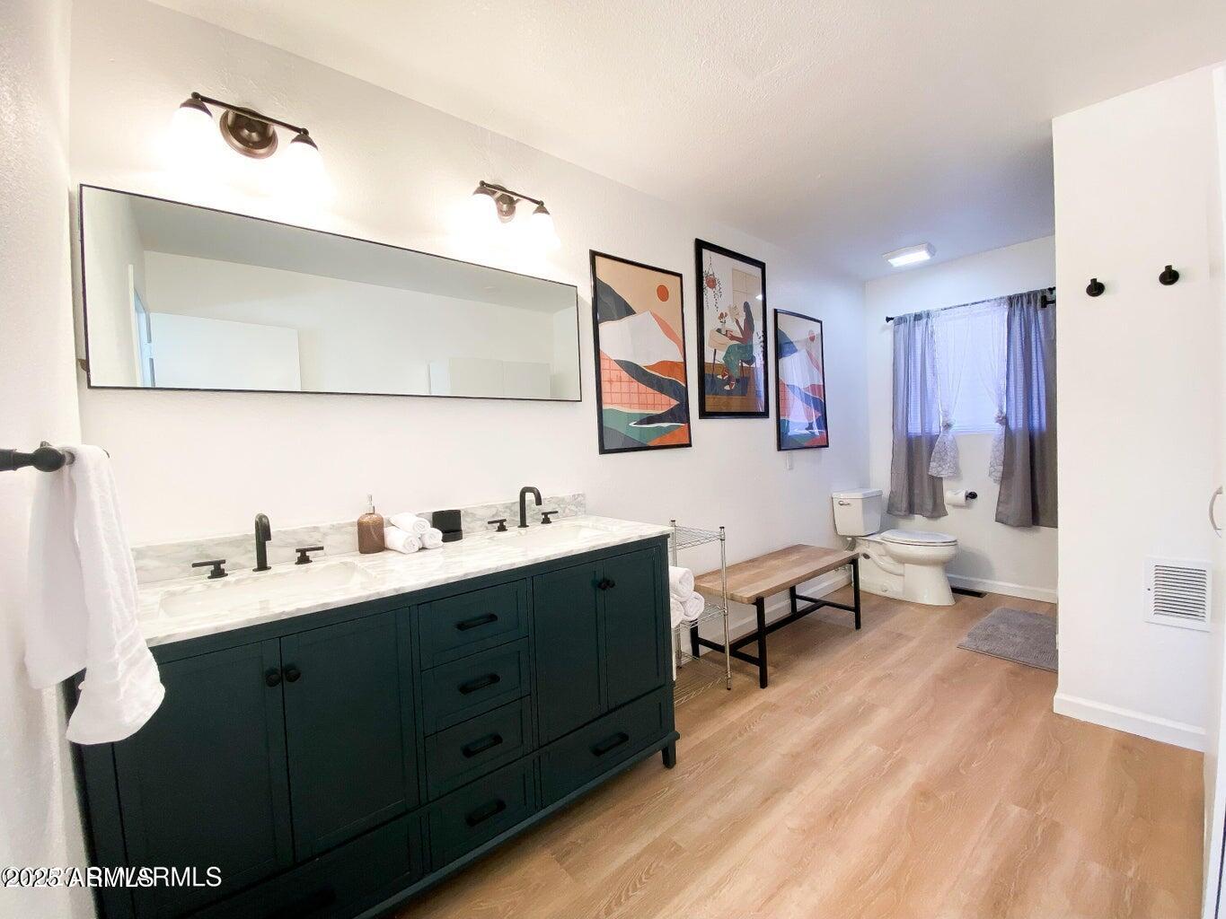 900 Rabbit Run Clarkdale, AZ 86324 - Photo 18 of 41 a spacious bathroom with a double vanity sink and a mirror