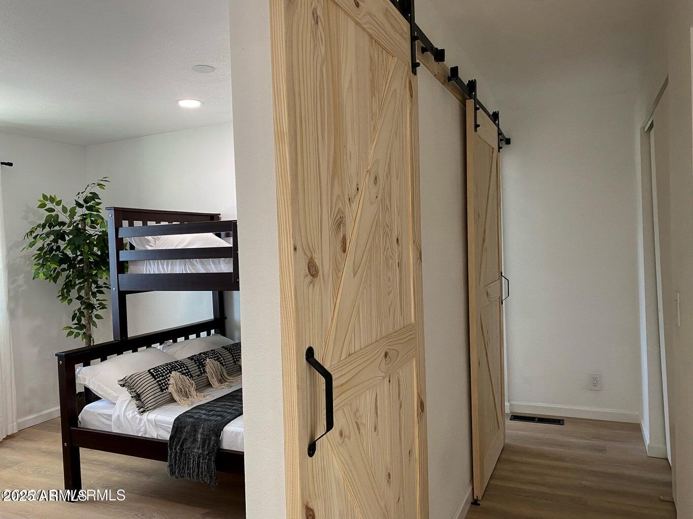 900 Rabbit Run Clarkdale, AZ 86324 - Photo 21 of 41 a view of a hallway with wooden floor and staircase