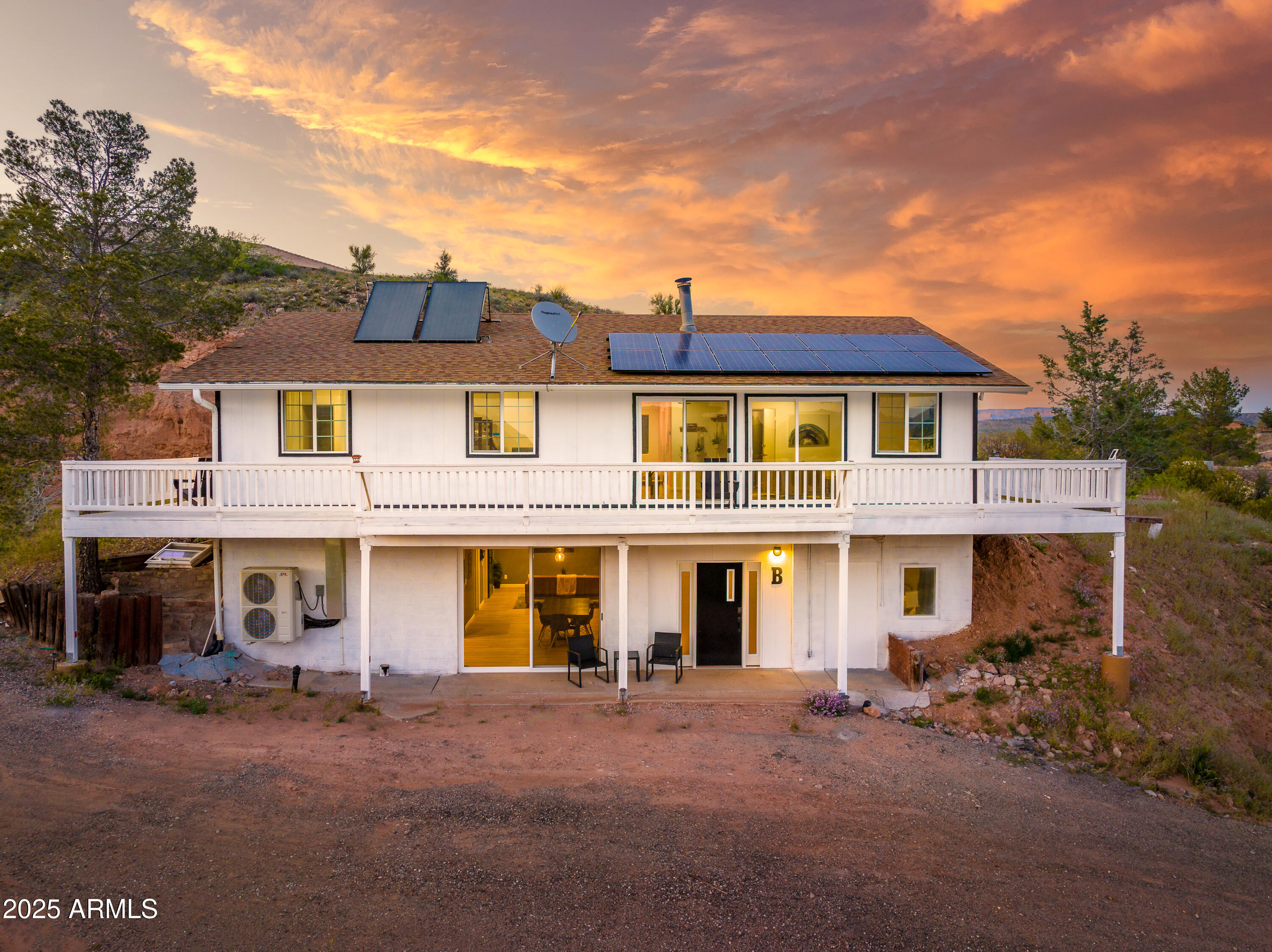 900 Rabbit Run Clarkdale, AZ 86324 - Photo 3 of 41 a front view of a residential apartment building with a yard