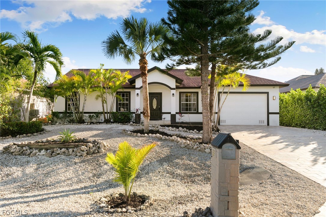 317 3rd Avenue Marco Island, FL 34145 - Photo 1 of 29 a view of a house with swimming pool and sitting area