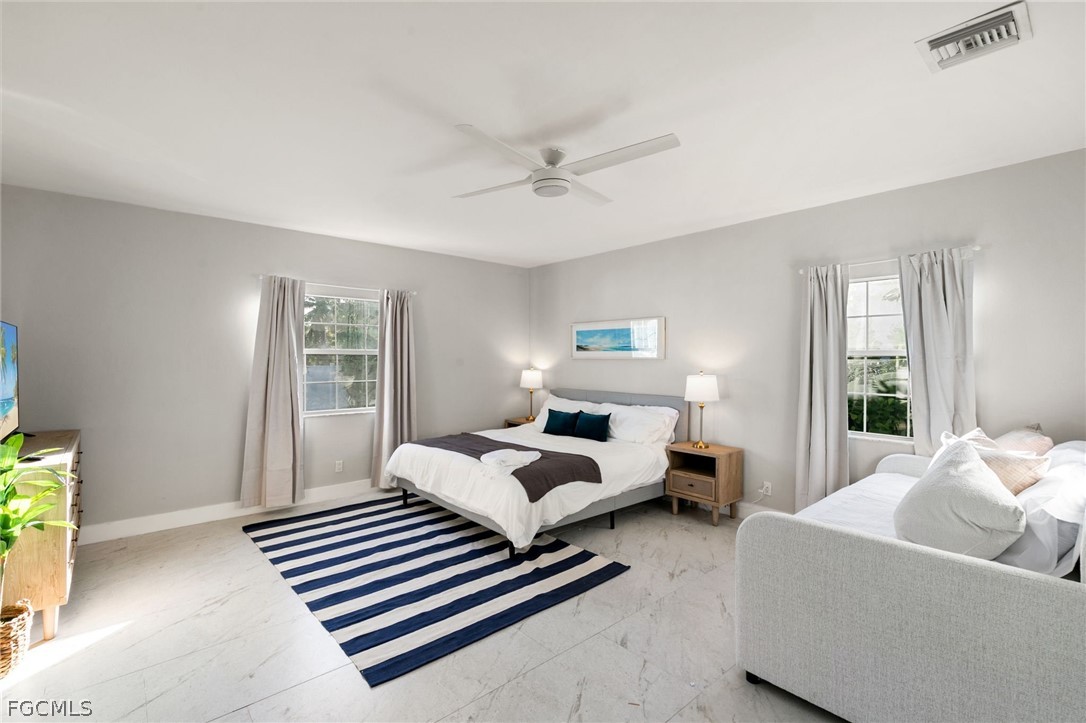 317 3rd Avenue Marco Island, FL 34145 - Photo 11 of 29 a bedroom with furniture and a window