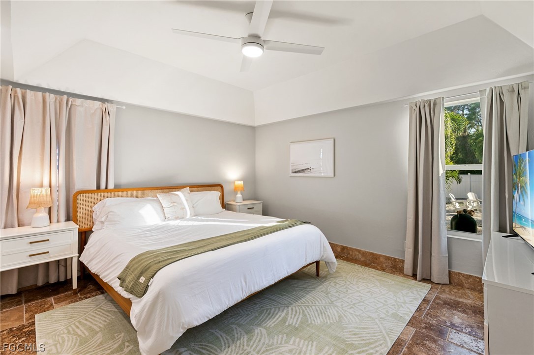 317 3rd Avenue Marco Island, FL 34145 - Photo 18 of 29 a bedroom with a bed and a window