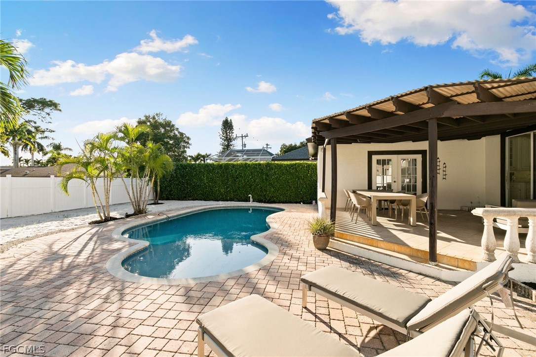317 3rd Avenue Marco Island, FL 34145 - Photo 26 of 29 a view of a house with backyard porch and sitting area