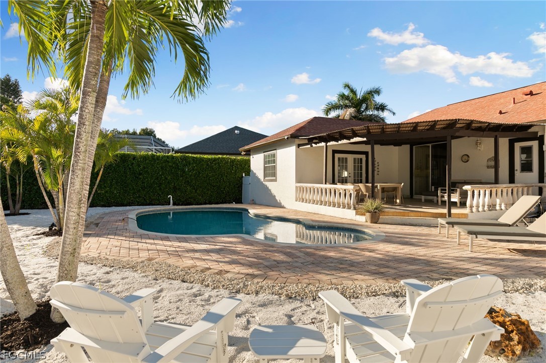 317 3rd Avenue Marco Island, FL 34145 - Photo 27 of 29 a front view of a house with garden