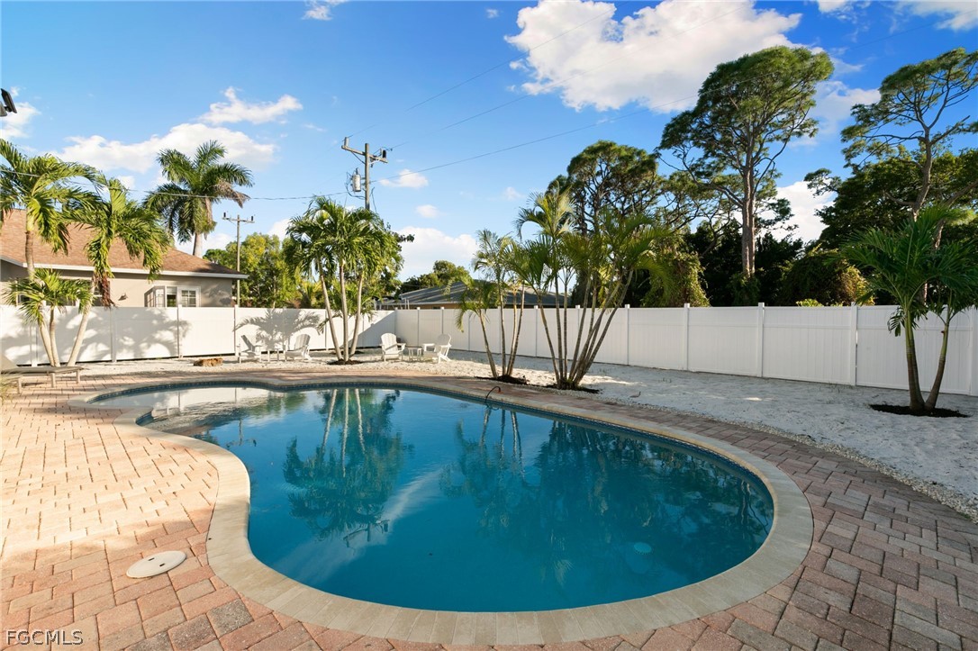 317 3rd Avenue Marco Island, FL 34145 - Photo 28 of 29 a view of a swimming pool with a patio