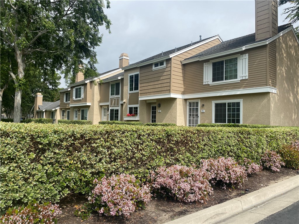 73 Thicket, Unit 48 Irvine, CA 92614 - Photo 1 of 1 front view of a house with a yard