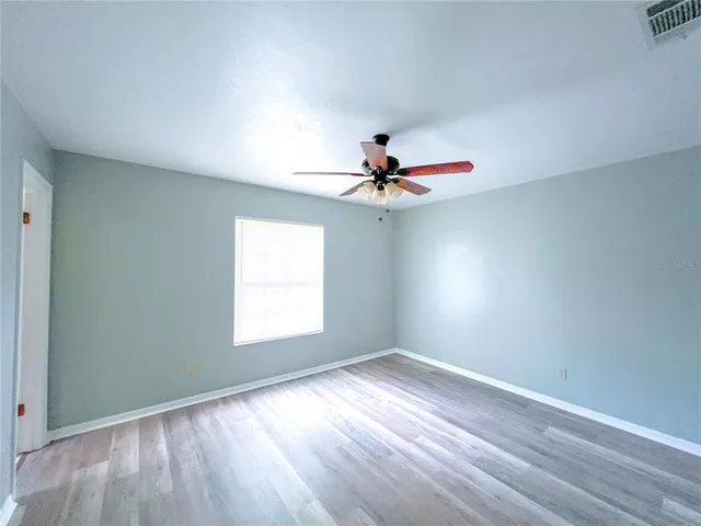 a bathroom with a sink a large mirror and a bathtub