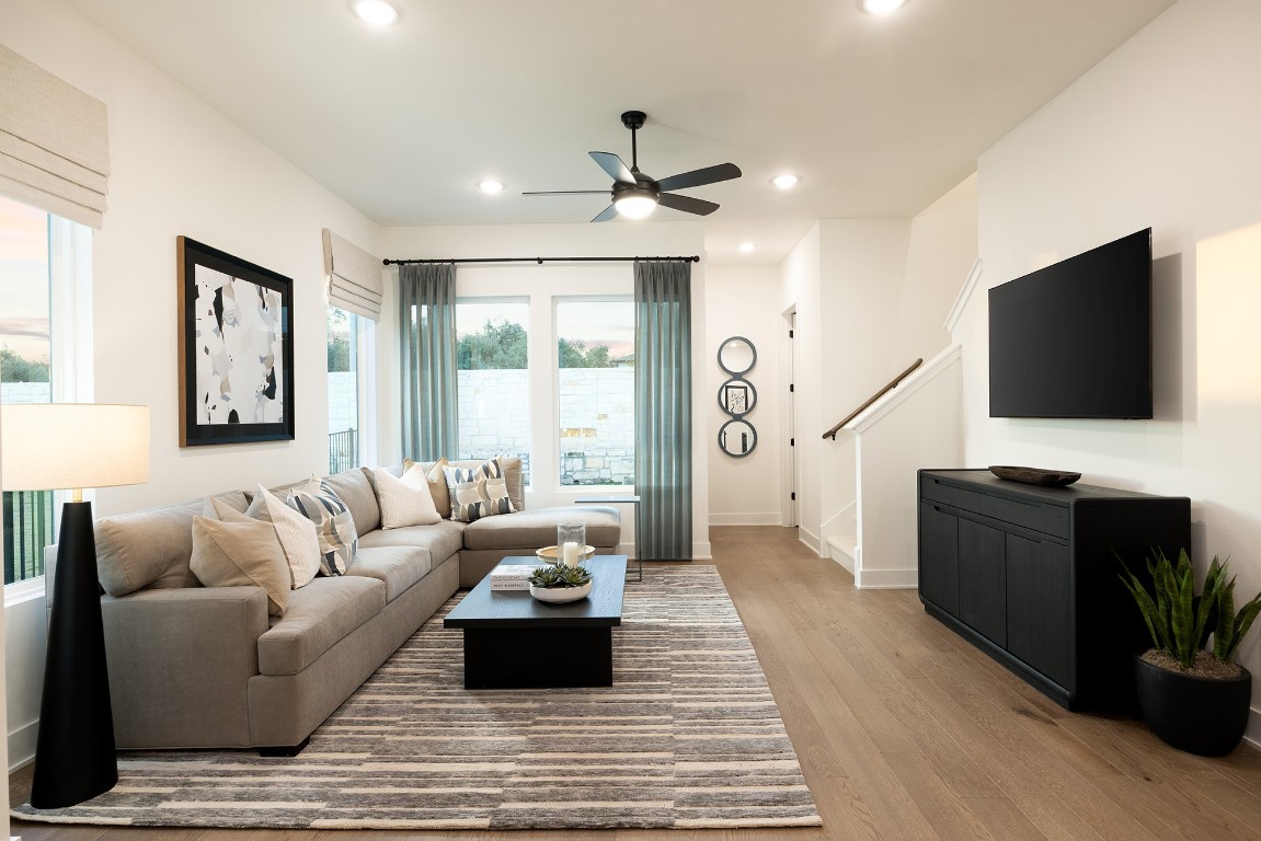 1310 Sweet Bark Street Austin, TX 78745 - Photo 11 of 13 a living room with furniture and a flat screen tv