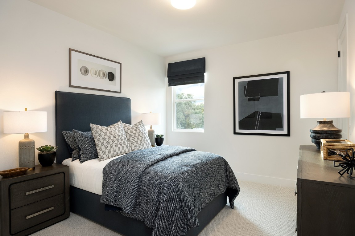 1310 Sweet Bark Street Austin, TX 78745 - Photo 3 of 13 a bedroom with a bed and a window