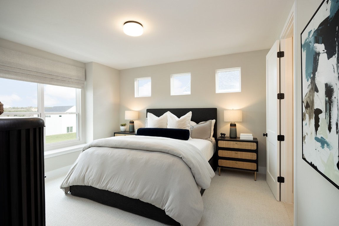 1310 Sweet Bark Street Austin, TX 78745 - Photo 5 of 13 a bedroom with a bed and a window