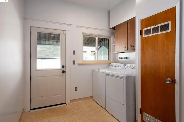 a utility room with closet dryer and washer