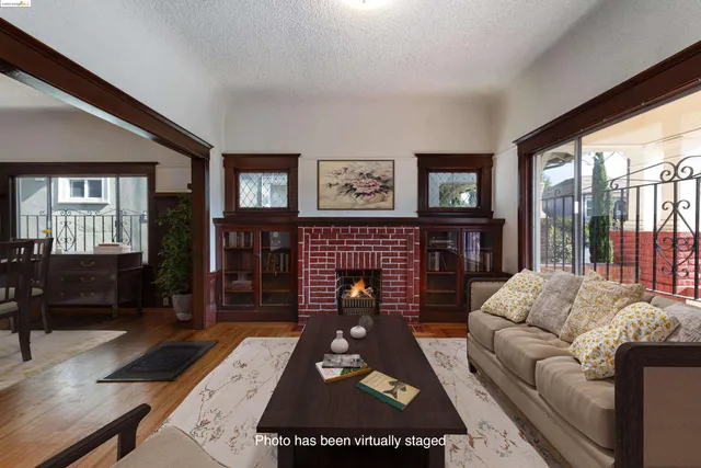 a living room with furniture a rug and a fireplace