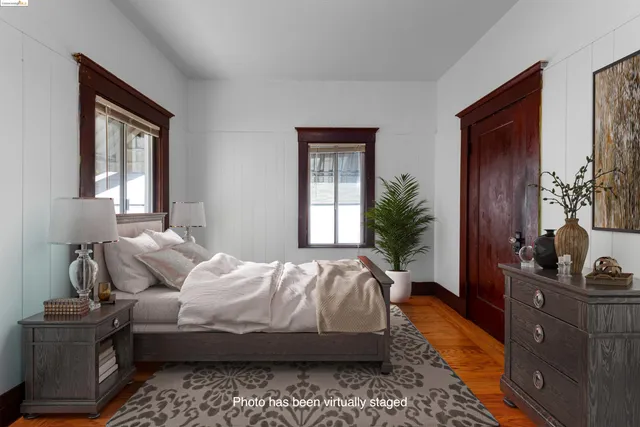 a bedroom with furniture and a window