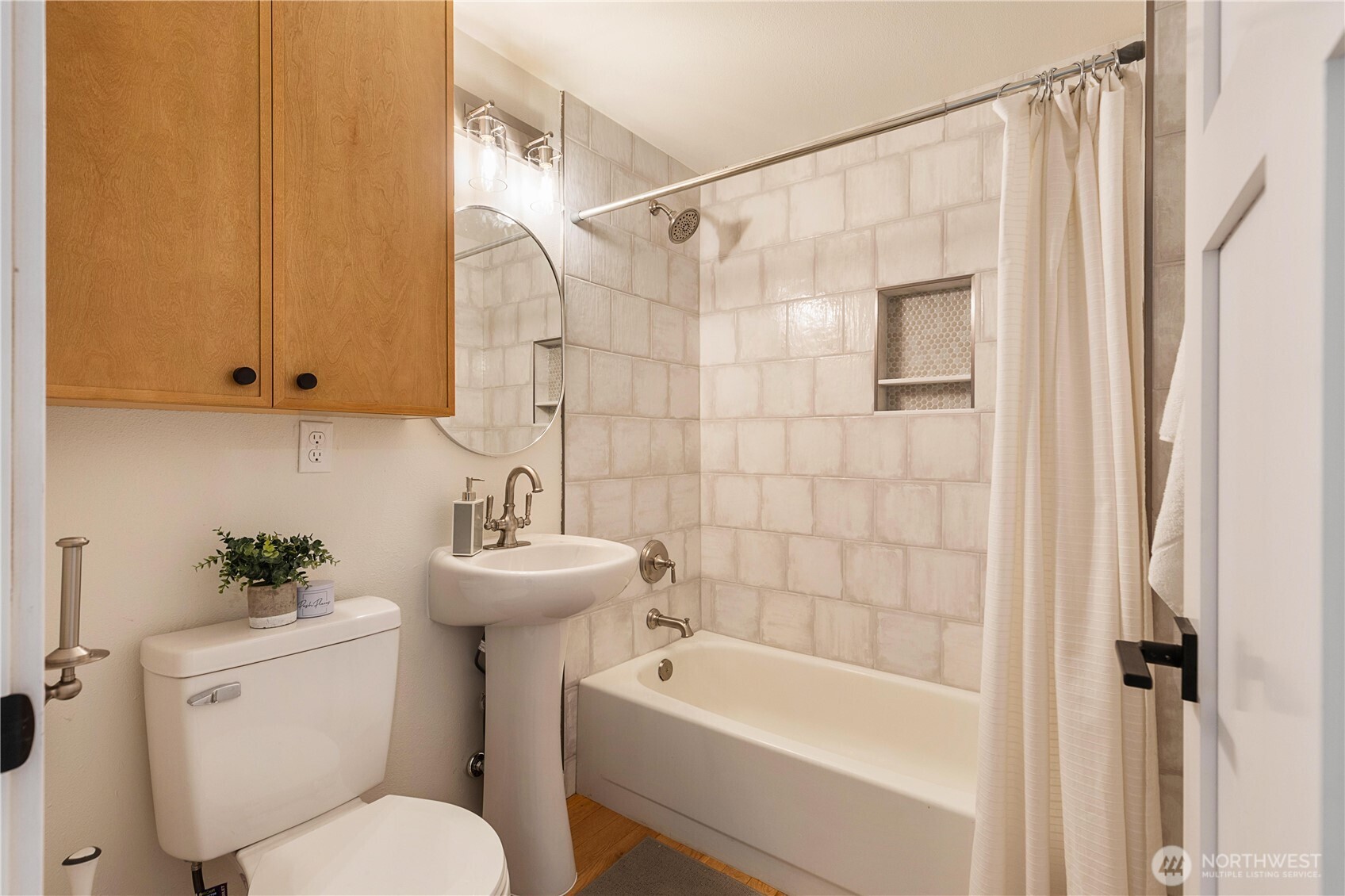 6031 McKinley Place North Seattle, WA 98103 - Photo 20 of 40 a bathroom with a sink toilet and shower