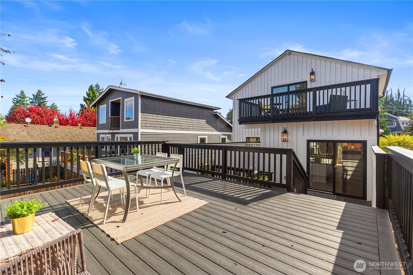 6031 McKinley Place North Seattle, WA 98103 - Photo 2 of 40 a view of a house with wooden deck