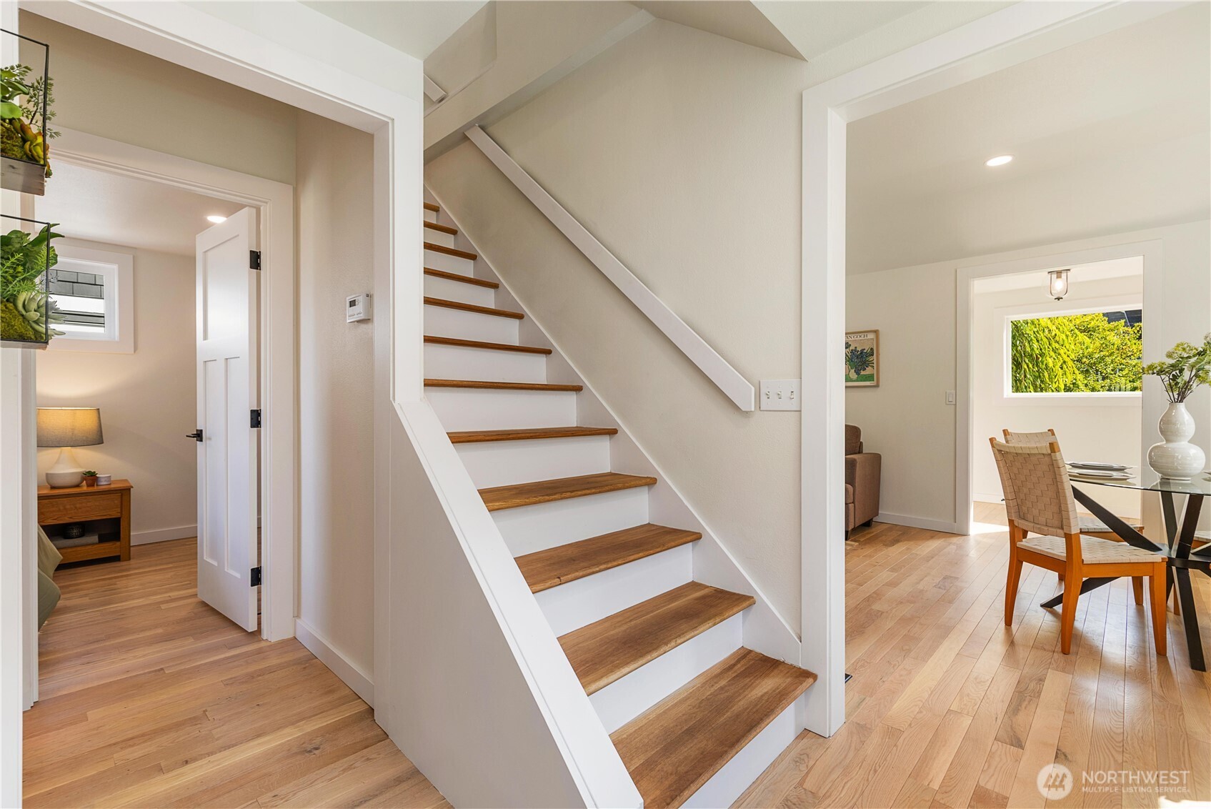 6031 McKinley Place North Seattle, WA 98103 - Photo 22 of 40 a view of a hallway view with wooden floor and staircase