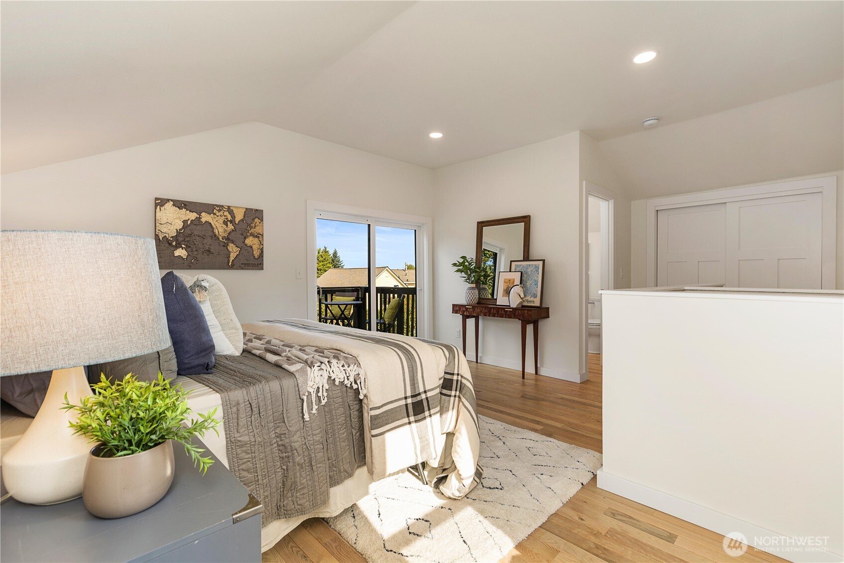 6031 McKinley Place North Seattle, WA 98103 - Photo 23 of 40 a bed room with a bed and a potted plant