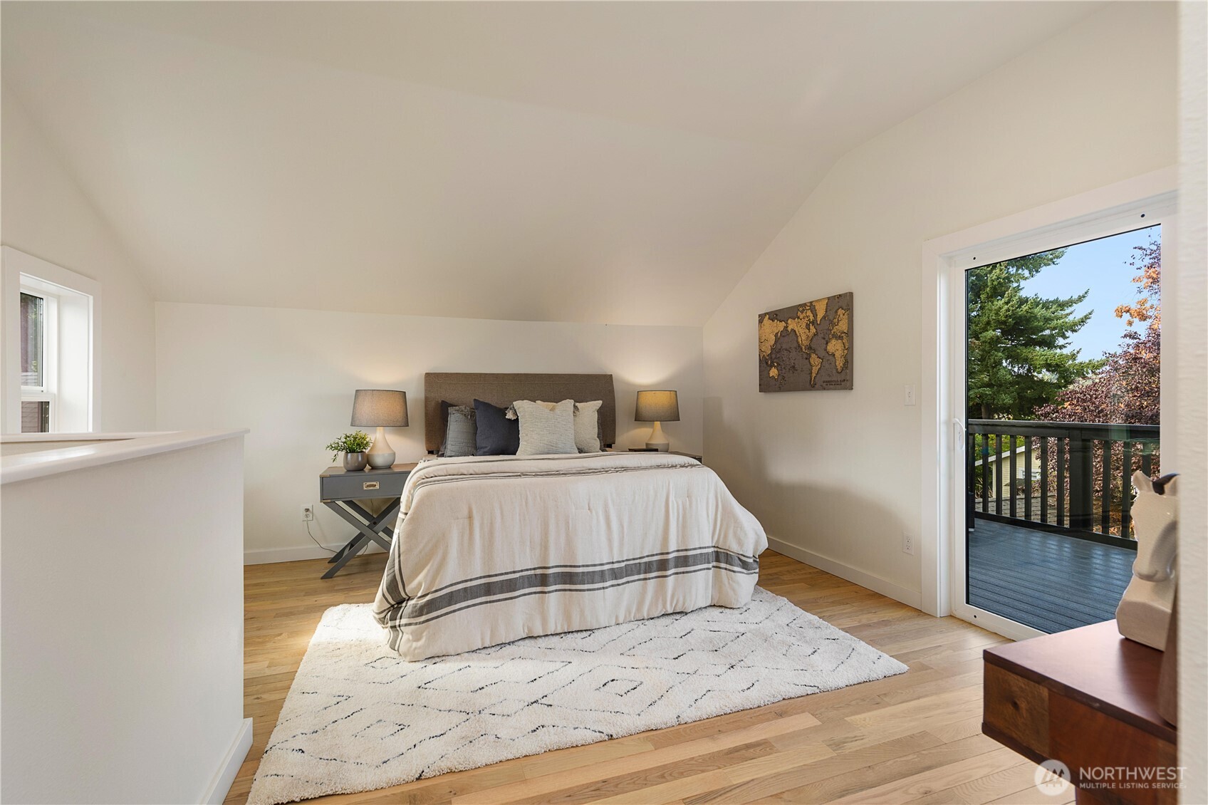 6031 McKinley Place North Seattle, WA 98103 - Photo 24 of 40 a bedroom with a bed a window and walk in closet