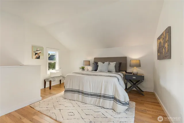 a bedroom with a bed and a night stand