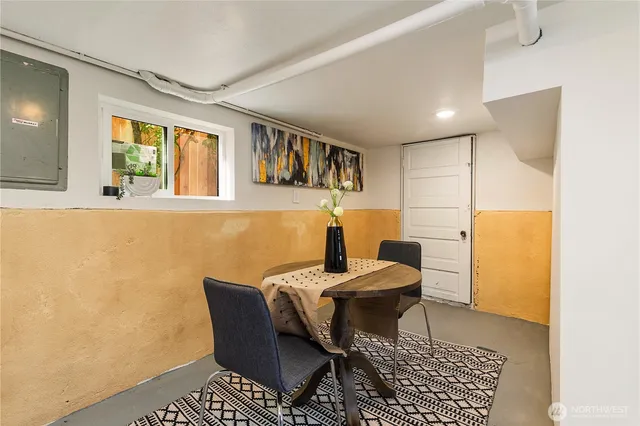 a bedroom with a bed and lamp