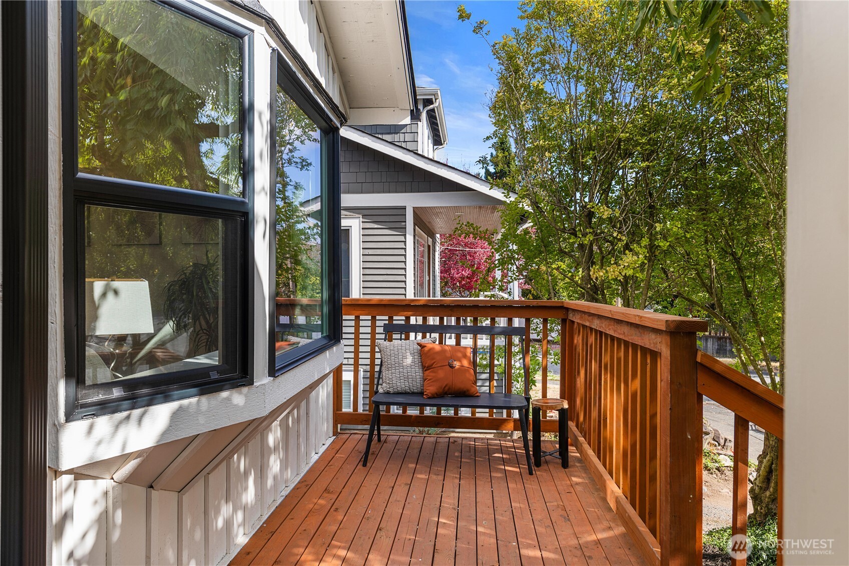 6031 McKinley Place North Seattle, WA 98103 - Photo 7 of 40 a view of a wooden chairs on the roof deck