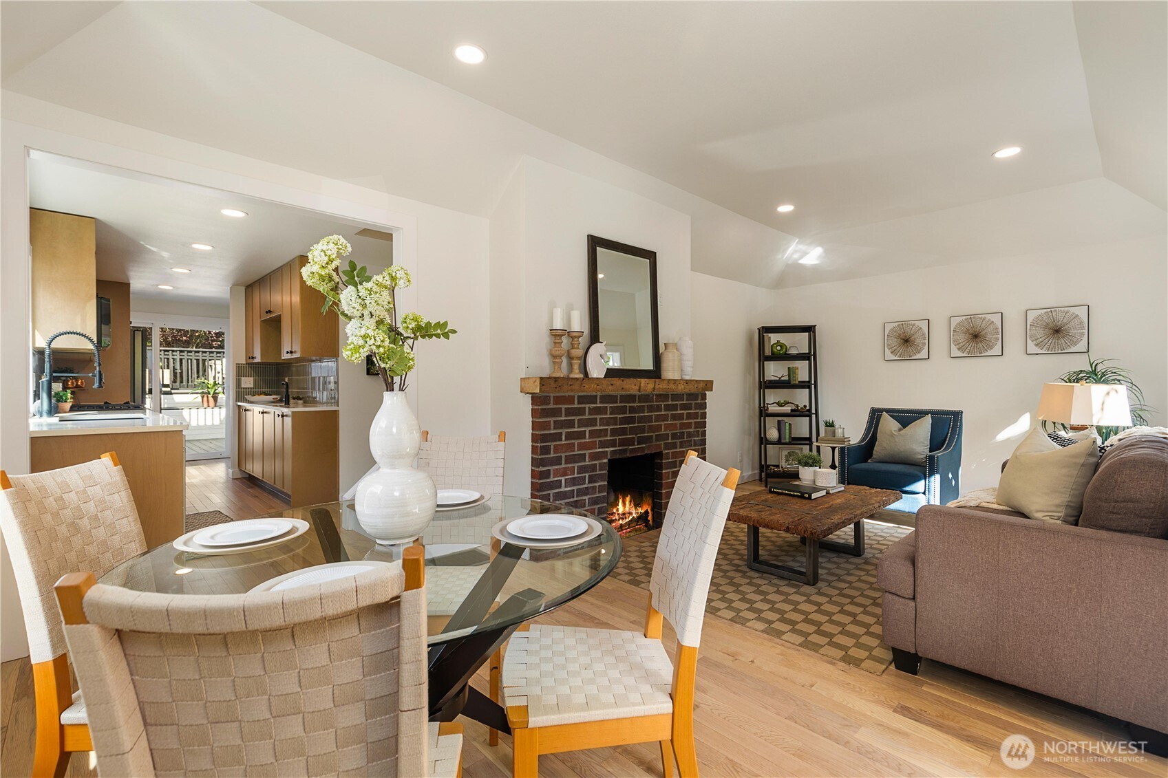 6031 McKinley Place North Seattle, WA 98103 - Photo 9 of 40 a living room with fireplace furniture and a wooden floor
