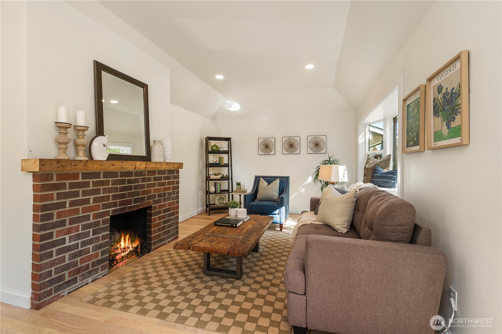 6031 McKinley Place North Seattle, WA 98103 - Photo 10 of 40 a living room with furniture and a fireplace