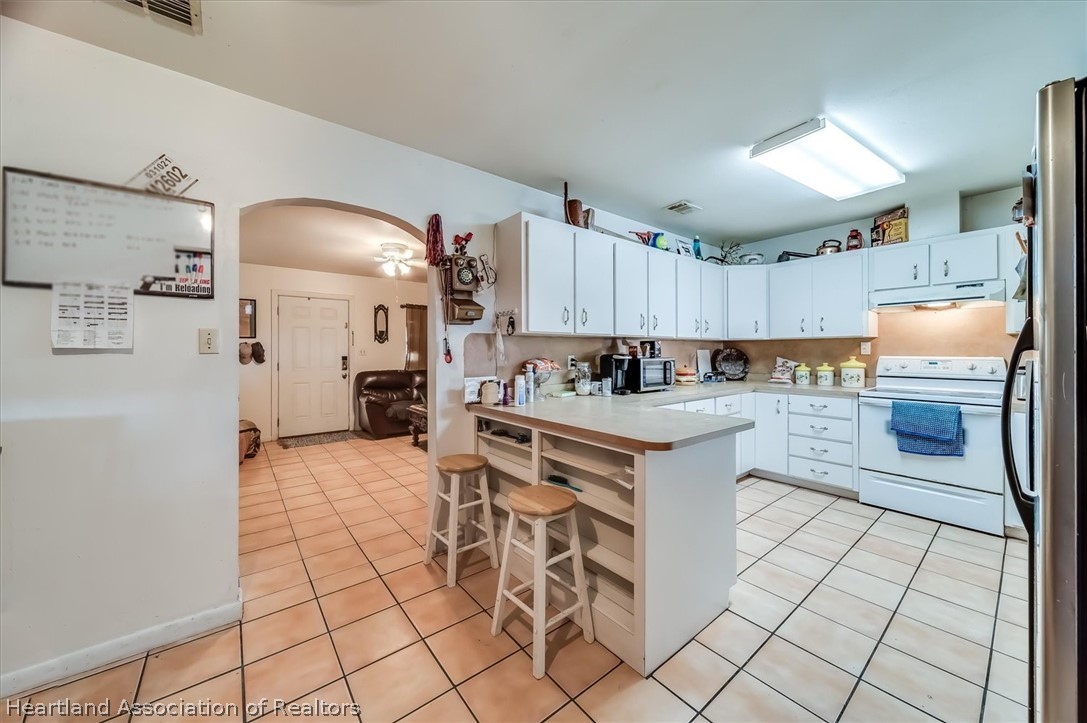 2364 County Line Road Bowling Green, FL 33834 - Photo 14 of 24 a kitchen with a sink and cabinets