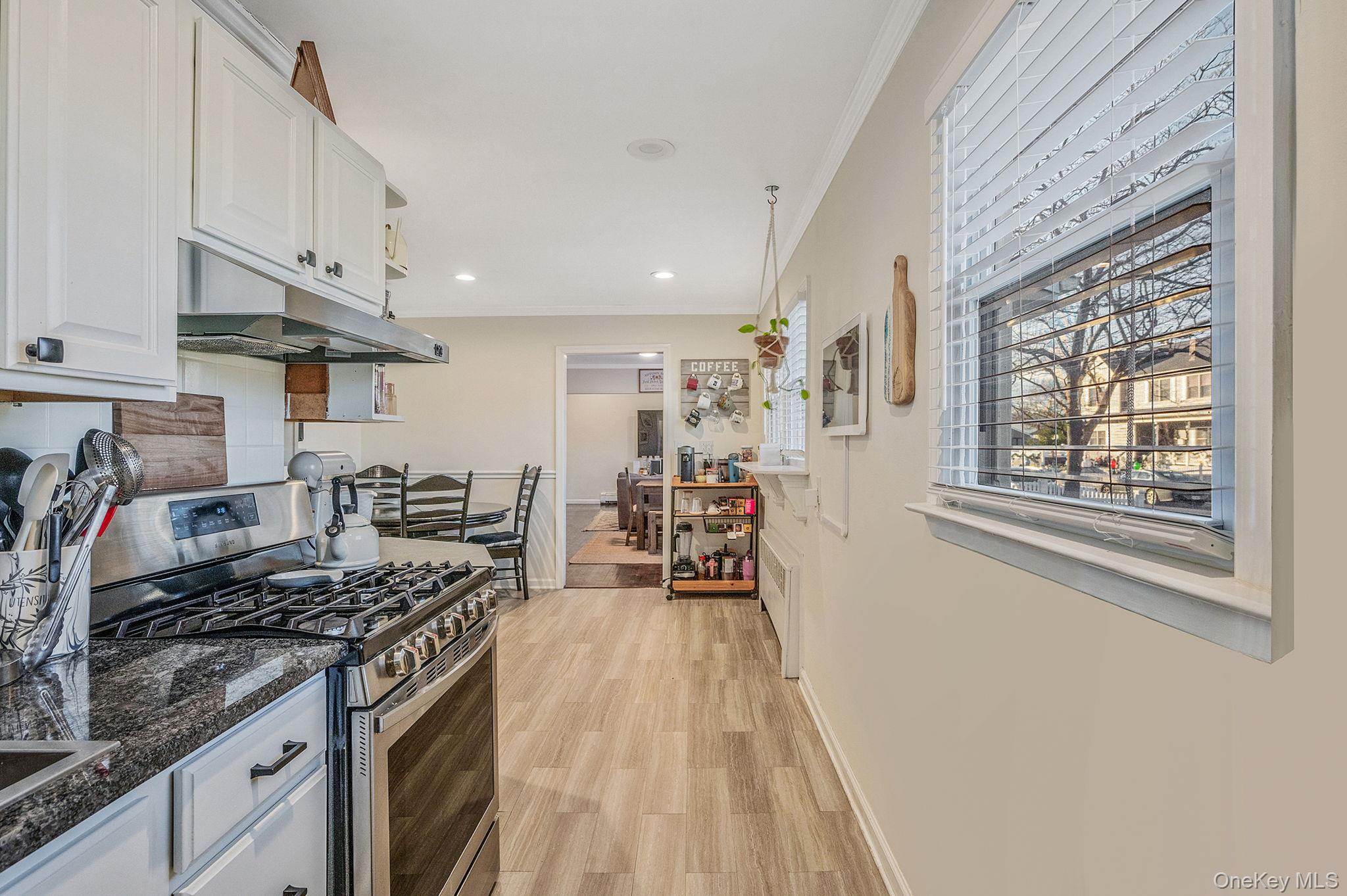 792 Frankford Road West Babylon, NY 11704 - Photo 16 of 39 a kitchen with stainless steel appliances granite countertop a stove and a sink