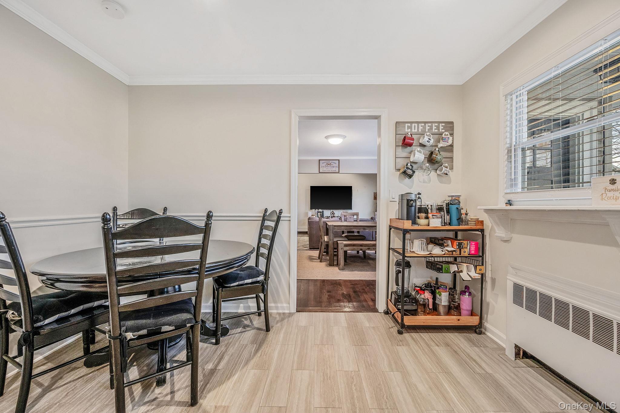 792 Frankford Road West Babylon, NY 11704 - Photo 18 of 39 a view of a workspace with furniture and a flat screen tv