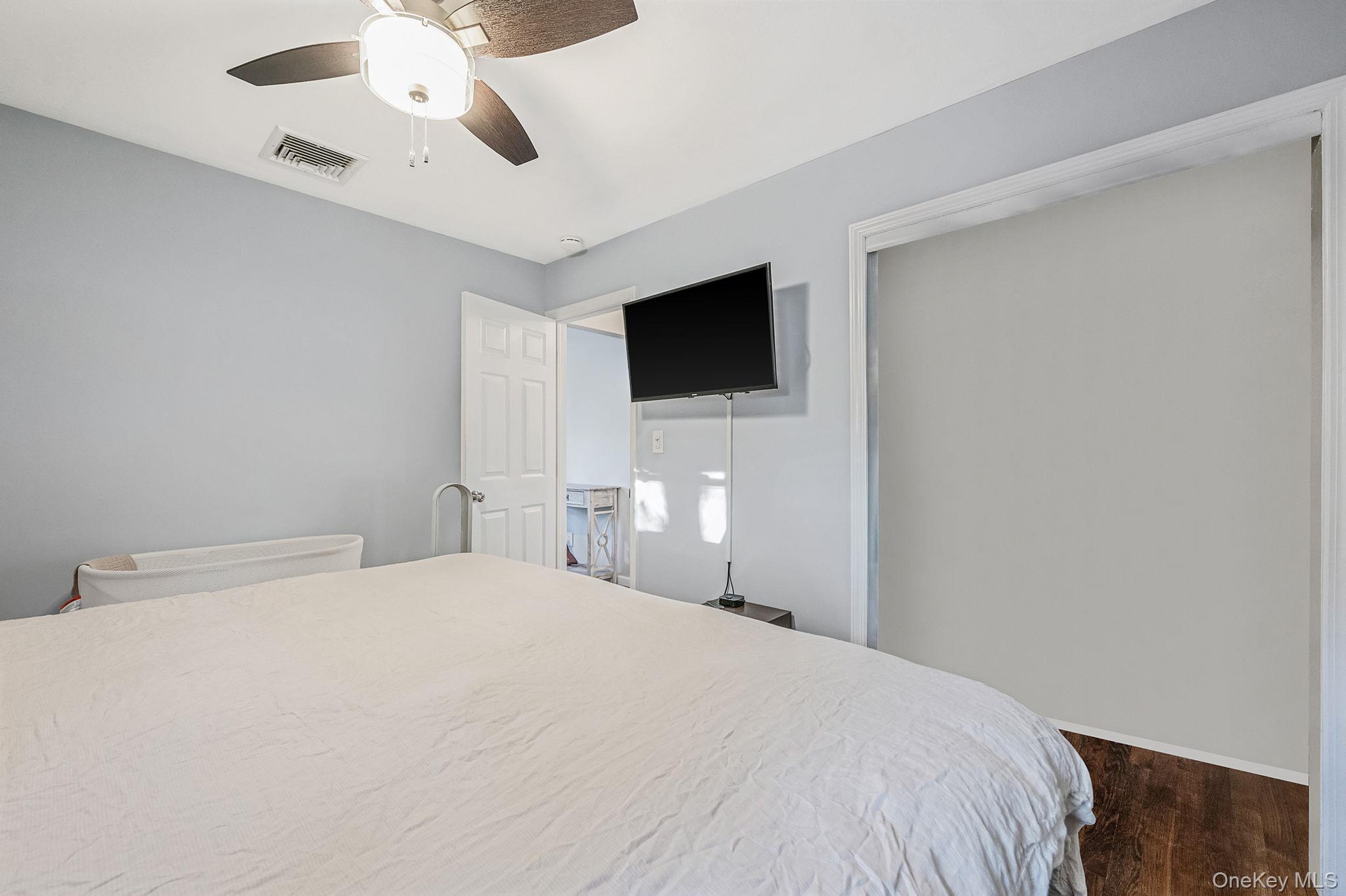 792 Frankford Road West Babylon, NY 11704 - Photo 24 of 39 a bedroom with a bed and a flat screen tv