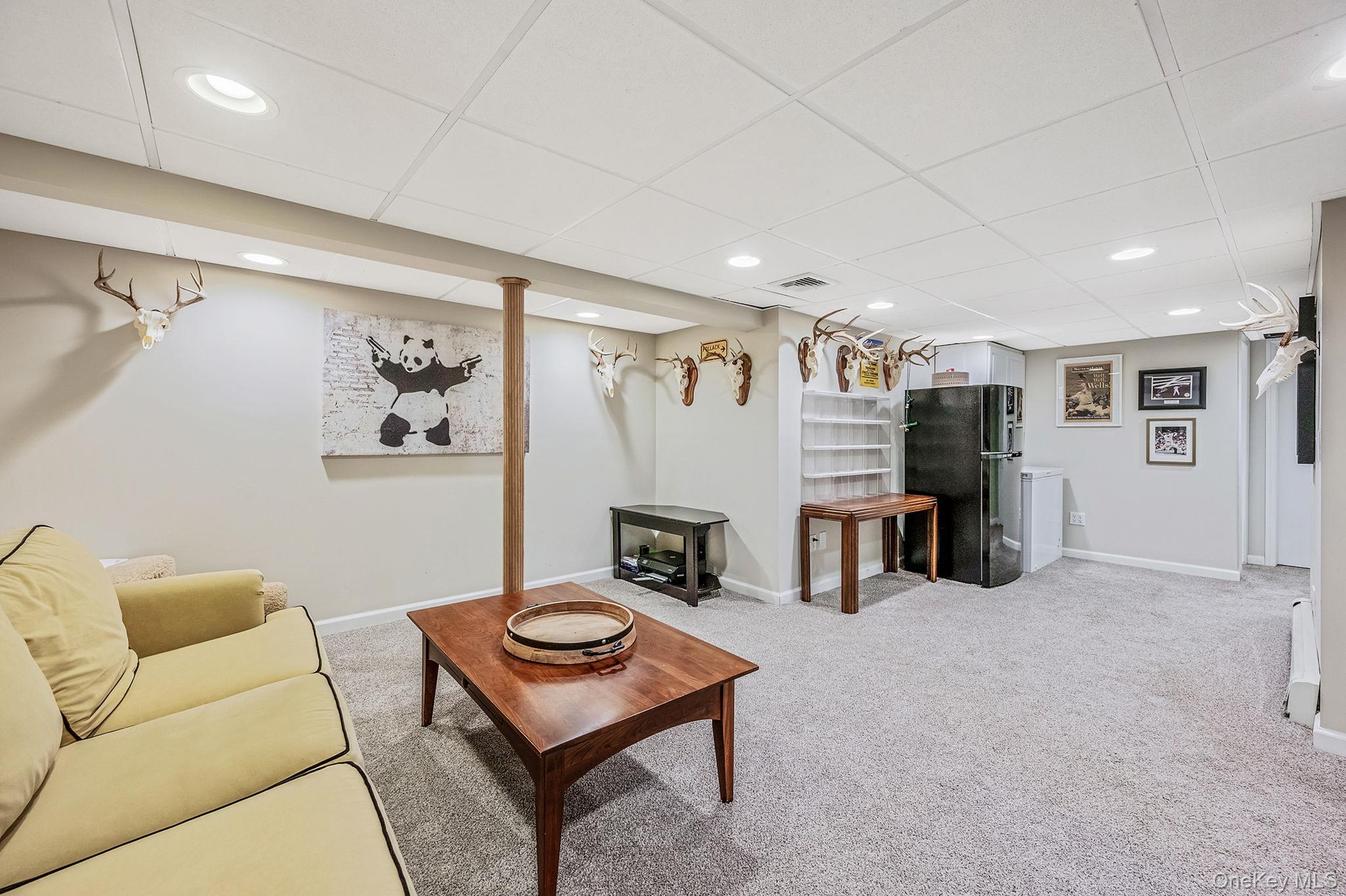 792 Frankford Road West Babylon, NY 11704 - Photo 30 of 39 a living room with furniture and a table