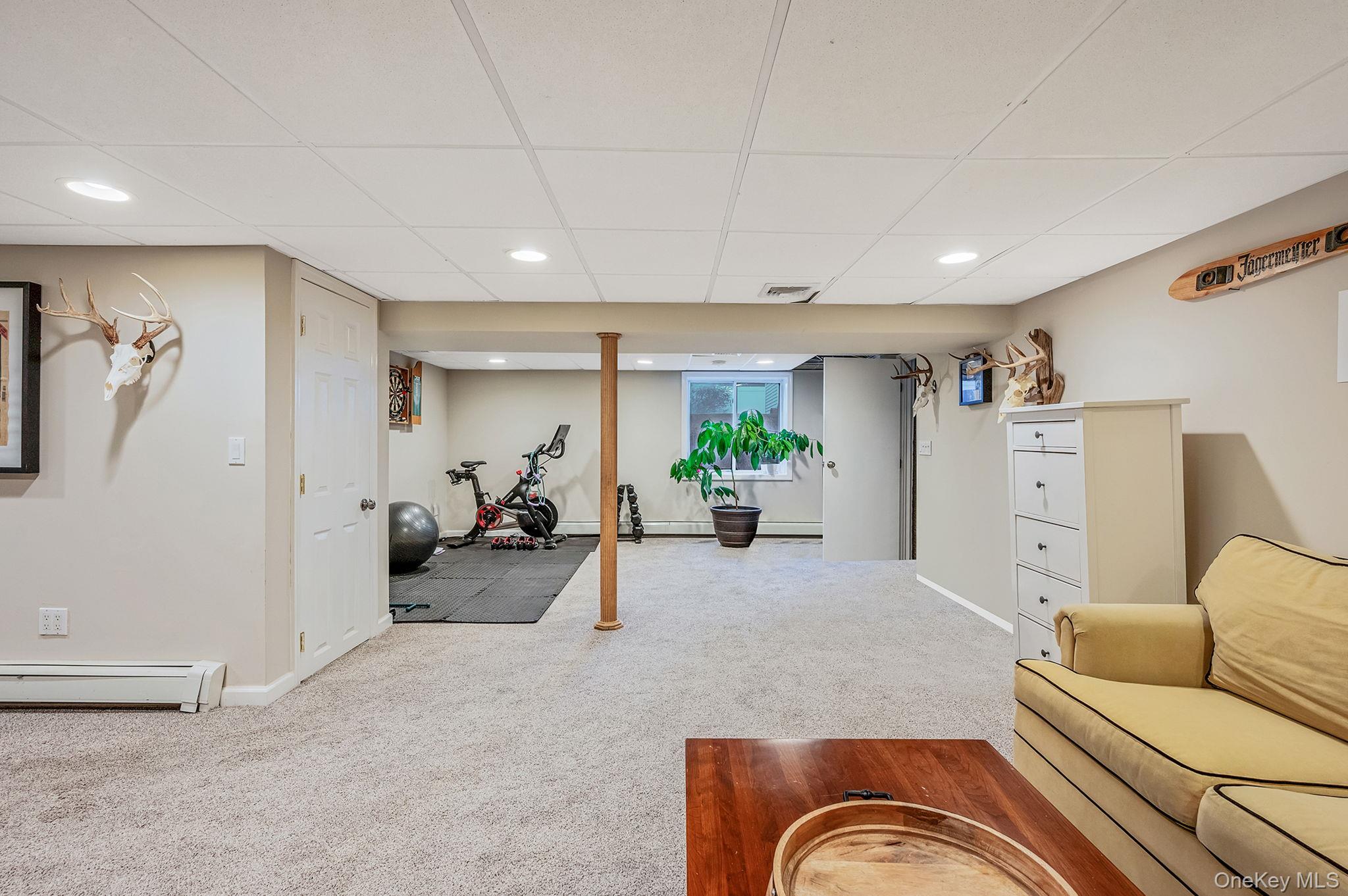 792 Frankford Road West Babylon, NY 11704 - Photo 32 of 39 a living room with furniture potted plant and a couch