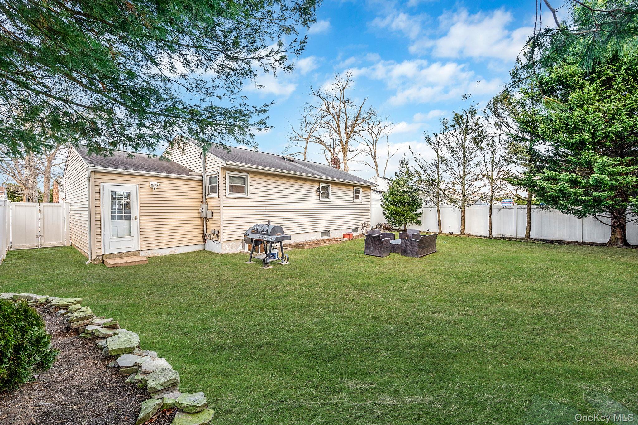 792 Frankford Road West Babylon, NY 11704 - Photo 38 of 39 a view of a backyard with large trees