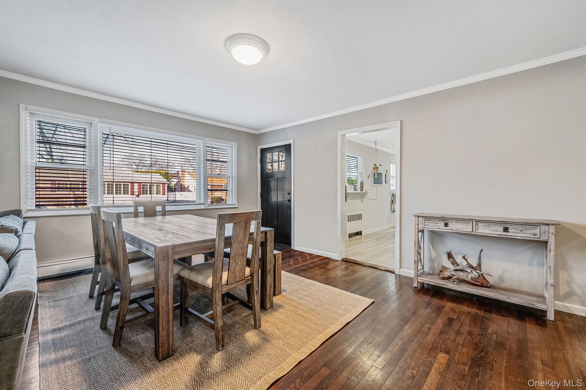 792 Frankford Road West Babylon, NY 11704 - Photo 4 of 39 a dining room with furniture and wooden floor